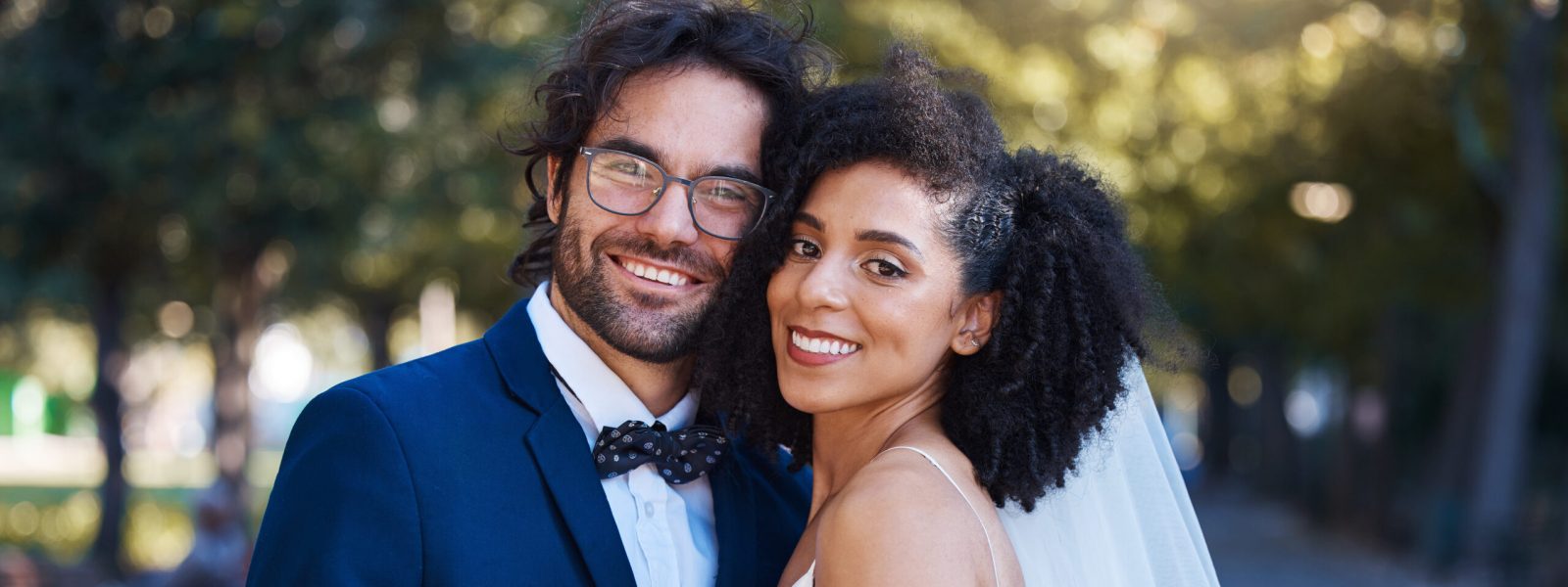 Couple portrait, wedding and happy dancing outdoor at marriage celebration event together with love. Interracial man and woman at park with trust, partnership and care for commitment to partner.